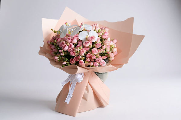 pink baby roses with orchid