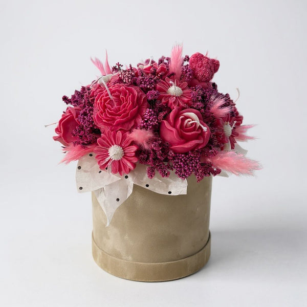 dark pink candles with dry flowers