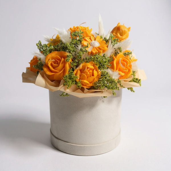 yellow candle with dry flower