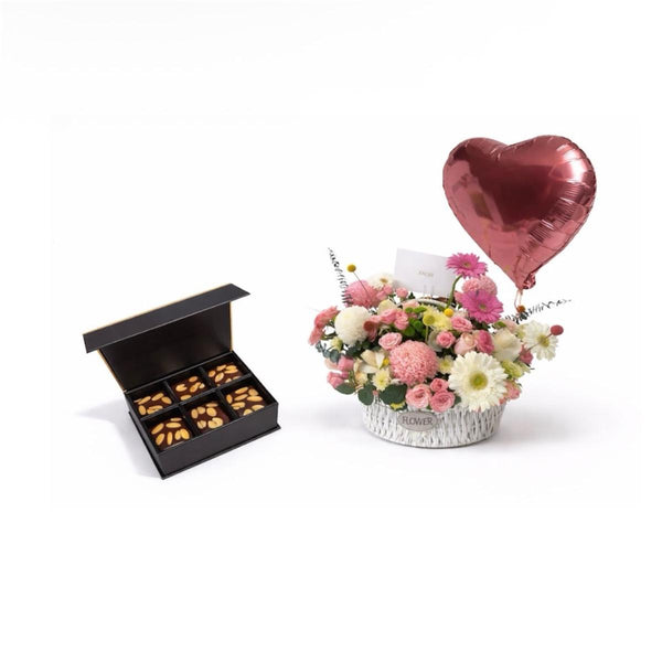 pink arrangement with chocolate